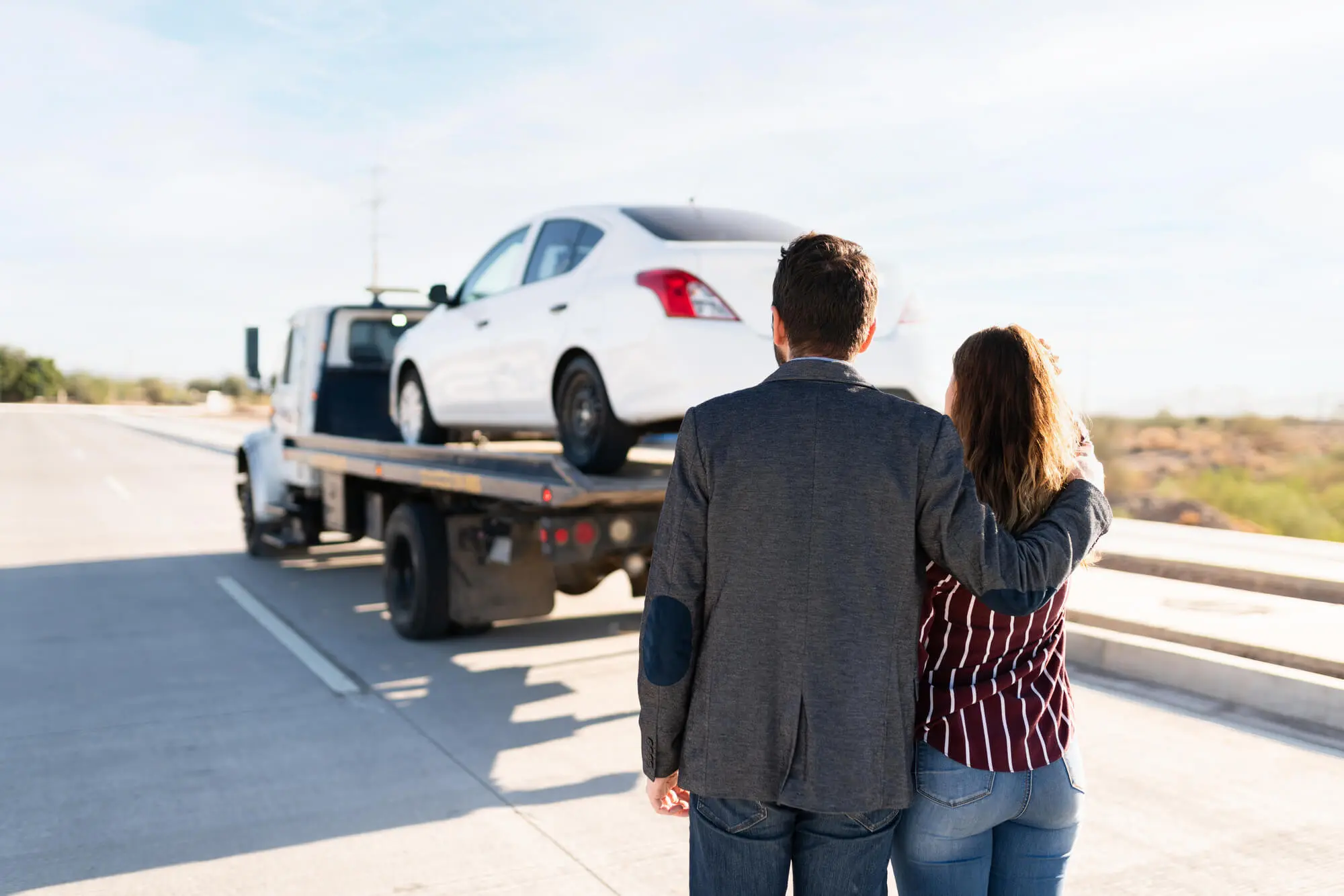 Man and young women hugging as they see their car 2026 03 25 09 09 34 utc.jpg