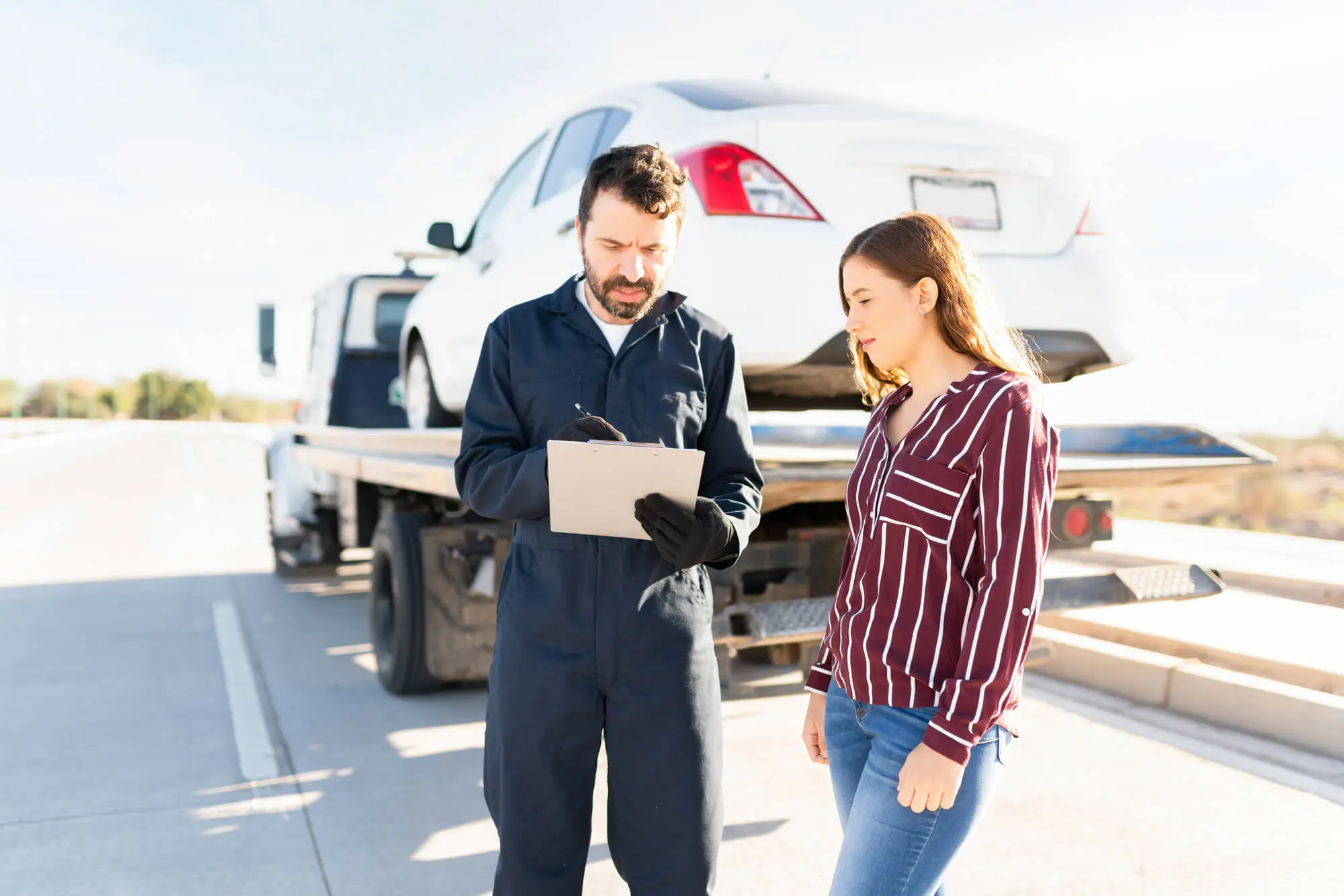Tow truck operator and female driver checking the 2026 01 09 11 50 30 utc.jpg