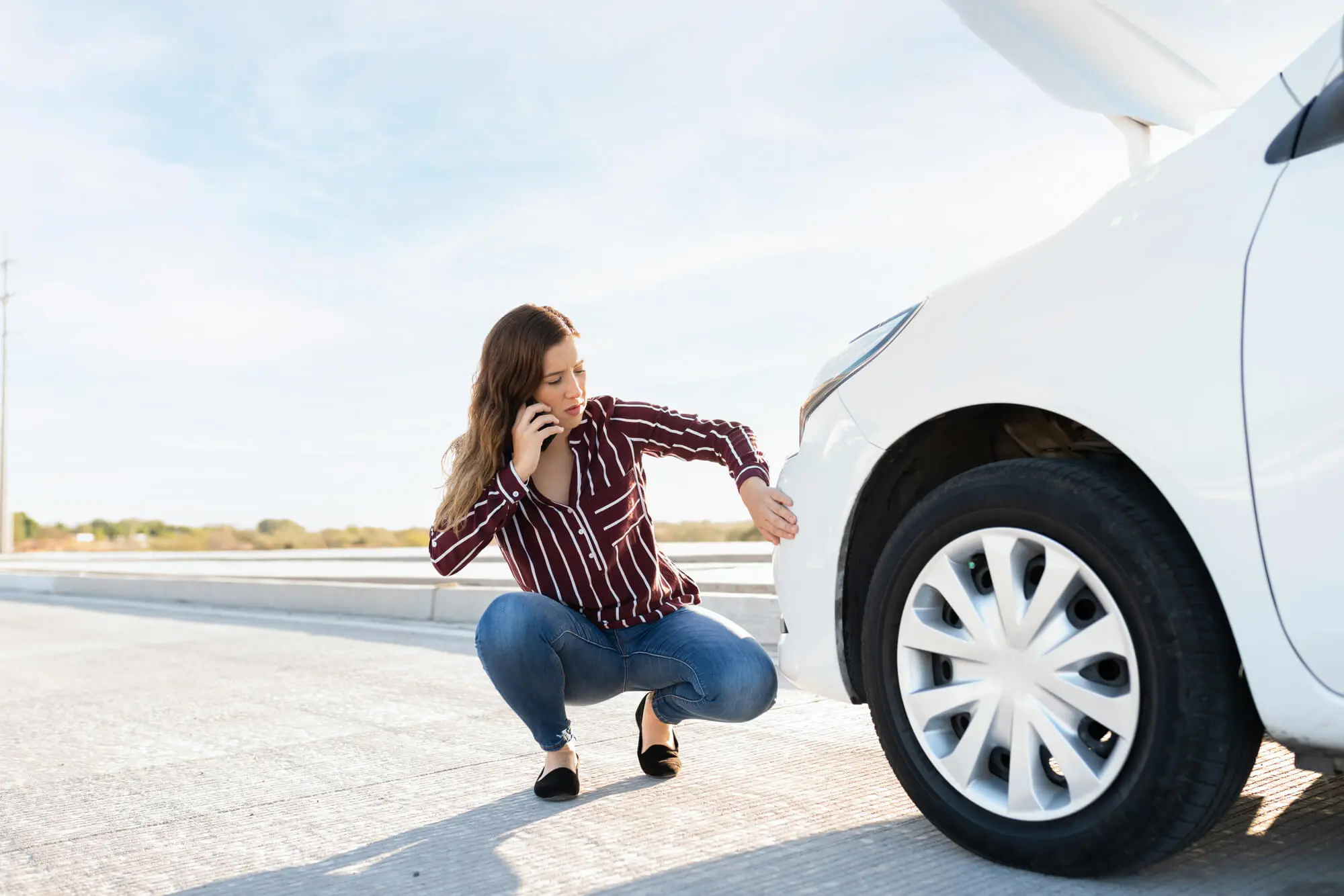 Young woman calling to get road assistance 2026 03 25 09 49 20 utc.jpg
